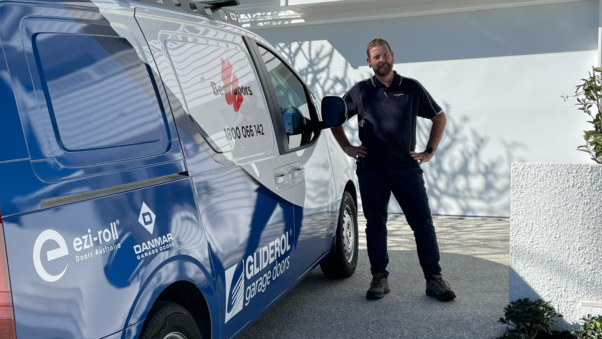 Installation team fitting a sectional door